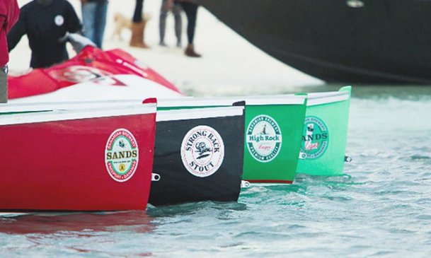 Sheldon Gibson receives his Man in Boat Race championship trophy from Bahamian Brewery's owner James 'Jimmy' Sands. Photo courtesy of Tim Aylen