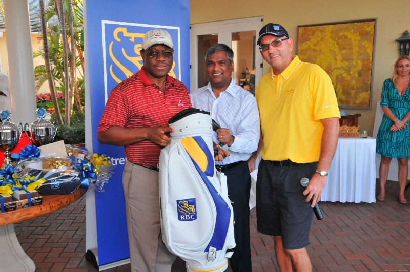 Felix Stubbs was the winner of an autographed Ernie Els PGA Tour Golf Bag.  Pictured left to right are: Felix Stubbs, Suresh Sookoo, CEO, Caribbean Banking, RBC; and Brian Knowles, Vice President, Corporate Banking, RBC.